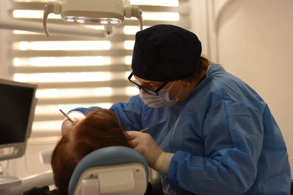 a dentist focused on performing a dental procedure on a patient