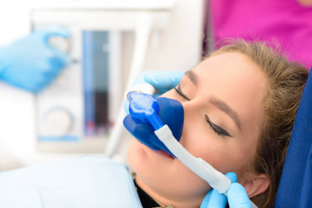 image of a woman under gas anesthesia during a dental procedure