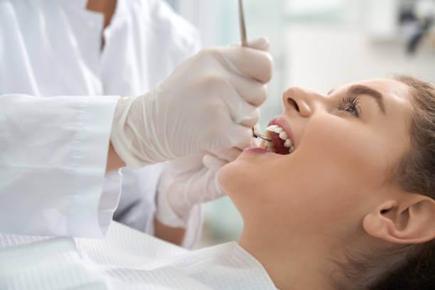 patient receiving dental scaling and root planning treatment, with a focus on plaque and tartar removal